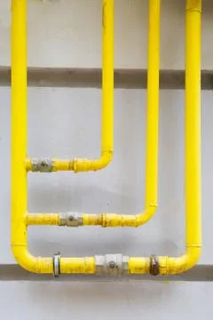 Gas pipe on the wall. Vertical Stock Photos