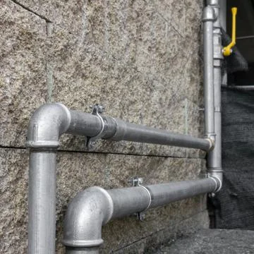 Gas pipes of a heating system Stock Photos