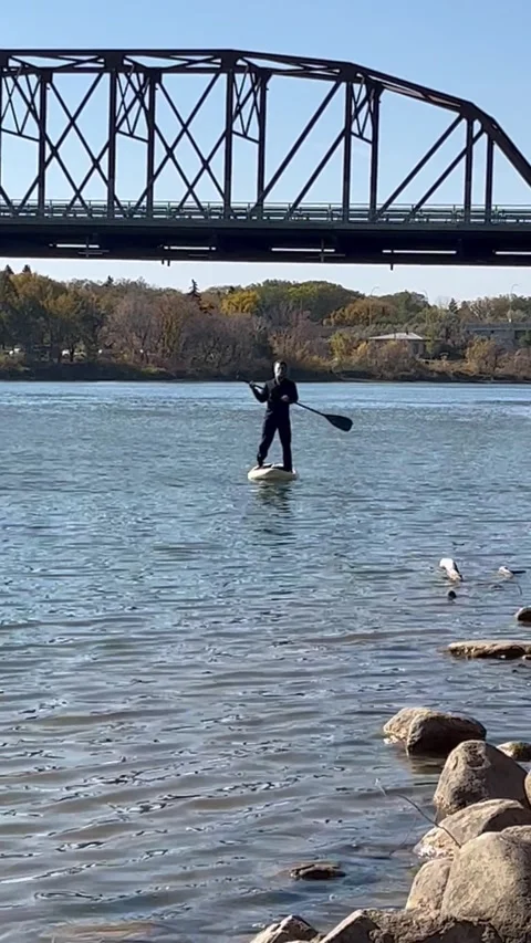 Gas Prices Even Have Michael Myers Using a Paddleboard, Saskatoon, Saskatchewan, Vídeo Stock 218869707