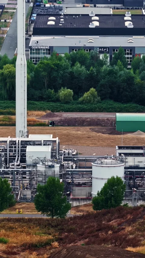 Gas Processing Plant with Exhaust Stack and Storage Tanks in Netherlands Stock Footage 346451912