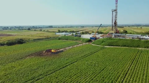 Gas producing industry. Crane working at enterprise. Gas deposit. Fire and pipes Stock-Footage 209278193