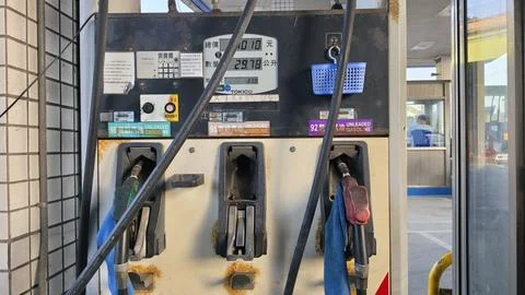 Gas pump display meter counting price and liters rapidly during refueling close 스톡 사진