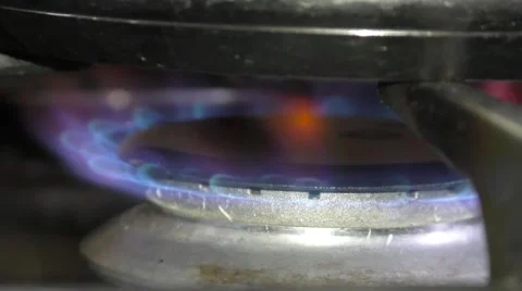 Gas ring under saucepan igniting Stock Footage 47393836