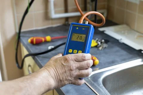 Gas Service Engineer Holding Digital Differential Manometer Pressure Meter Stock Photos