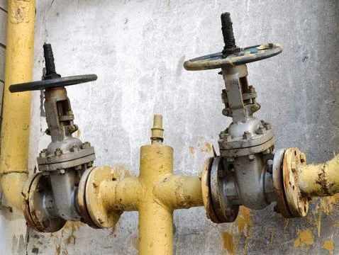 Gas shut off installations positioned on outside residential building facad.. Фото