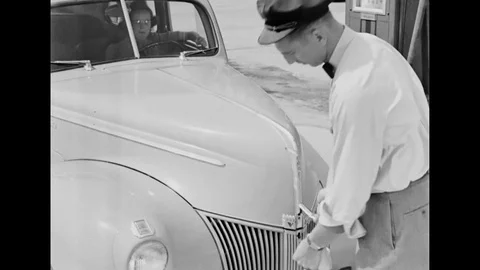 Gas Station Attendant Checking The Motor Oil Of A Car Stock Footage 99306329