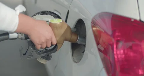 Gas station attendant open the fuel tank cap to fill full tank of gas. Stock Footage 222732853