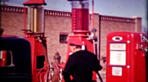 Gas station attendants pumps gas for customers 1940s vintage film home movie 631 Stock Footage