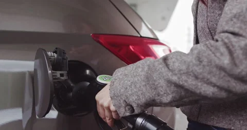 Gas Station Gas Pump Close Up. Pump Nozzles At Gas Station. Young Beautiful Stock Footage 149325076