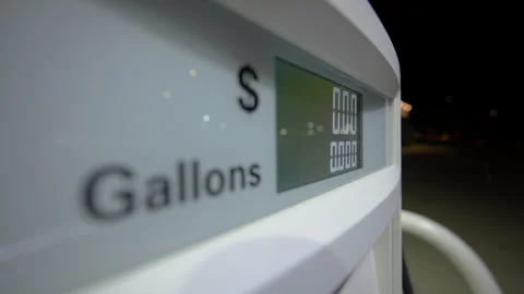 Gas station pump display showing fuel price and gallons during car gas refueling Stock Footage 334056816
