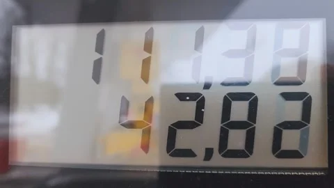 Gas station pump display showing rising fuel price Stock-Footage 334753365