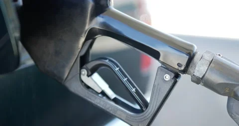 Gas Station Pump Handle being inserted then depressed and removed from Vidéo 204722236
