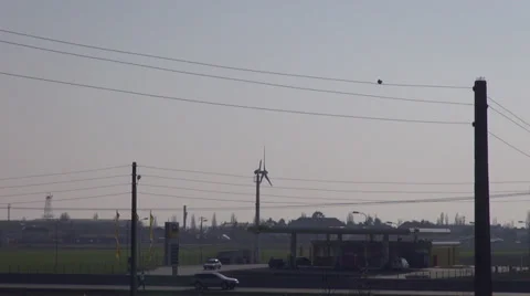 Gas station using wind energy, wind turbine, clean, green, renewable energy Stock Footage 36265497
