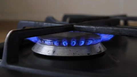 Gas stove burner ignition issue closeup with safety warning Stock Footage 339616573