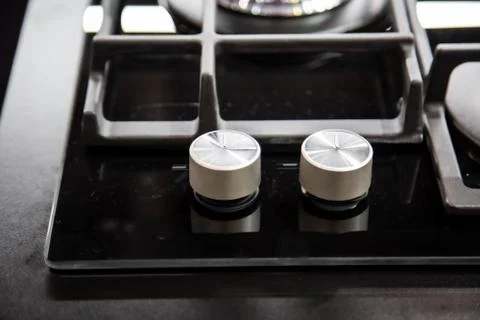 Gas stove burner knobs with black mirror surface of cooker and stainless steel Фото