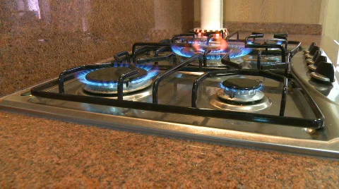 Gas stove burners flames dolly shot Stock Footage