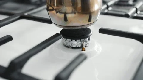 Gas stove with burning fire. Making coffee in copper cezve over gas stove. Stock Footage 152845371