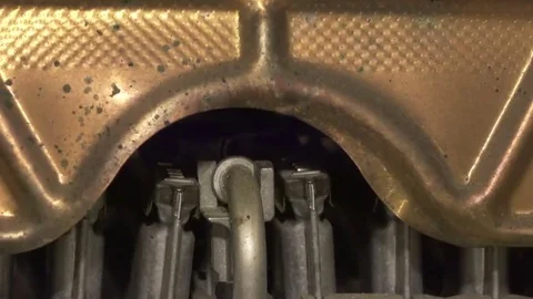 Gas water heater.  ignition torch is lit, then  main flame joins. Slow motion . Stock Footage 69103341