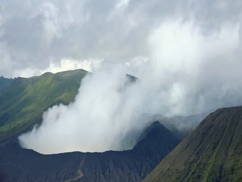 Gases emitted from vent of active volcano. Bromo seismic activity. Indonesia Stock-Footage 74384187