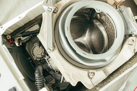 Gasket mount of a front loading washing machine being serviced without front Stock Photos