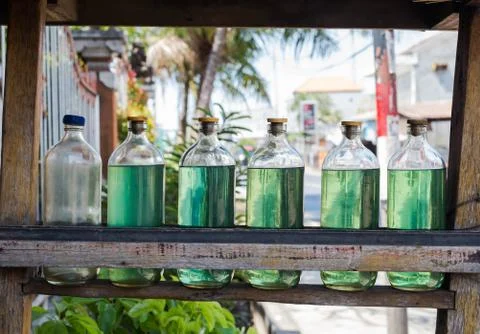 Gasolina in bottles for sale on bali Indonesia, petrol at local station Stock Photos