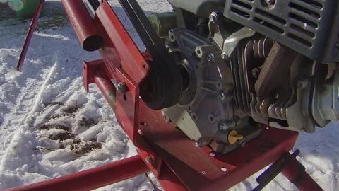 Gasoline engine running a grain auger Stock Footage 169844109