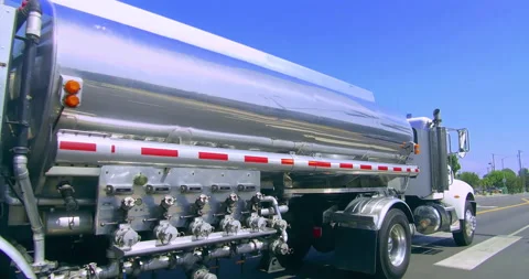 Gasoline oil trailer truck tanker driving to the gas station in Los Angeles, 4K Stock Footage