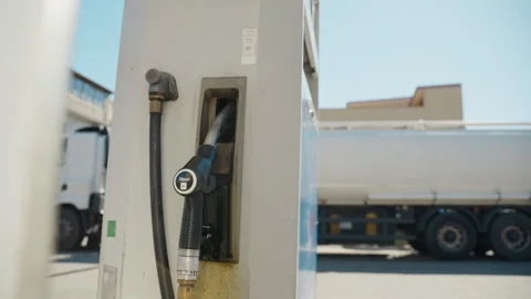 Gasoline pump with tanker truck background Stock Footage 336553853
