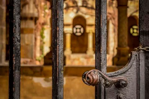 Gate, blurred old building in background. Stock Photos