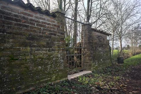 Gate in a brick wall Stock Photos