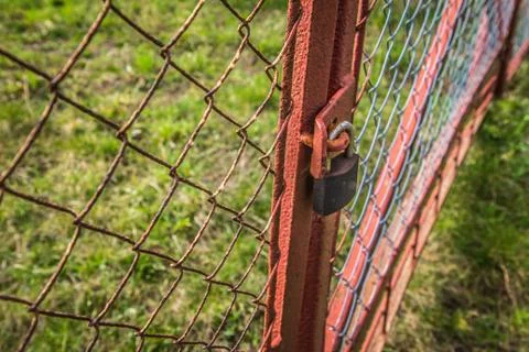 Gate closed with a padlock Fotos de archivo