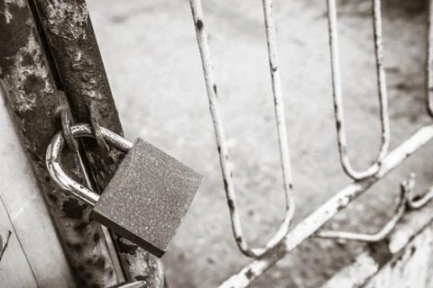 Gate closed with a padlock Stock Photos
