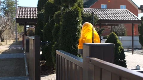 The gate is closed by remote control before entering the courtyard of the house Stock Footage 267718410