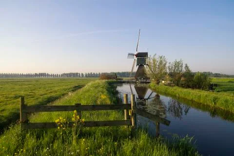 Gate in front of a windmill Foto stock