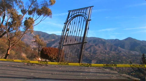 Gate left from fire with caution tape Stock Footage 419419