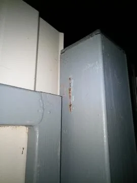 Gate opener on the gate column. Stock Photos