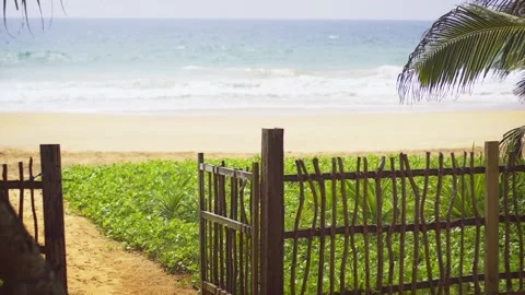Gate Opening to Pathway onto Beach in Hikkaduwa Stock Footage 153333061