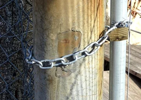 Gate Padlocked To Post With Chain Stock Photos