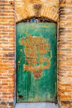 Gate in red bricks wall Stock Photos