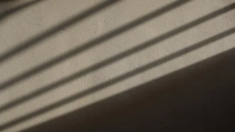 Gate Shadow projected on a Wall Stock Photos