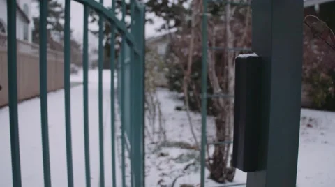 Gate Slamming Shut with Snow Falling off Slow Motion  Stock Footage 59990567