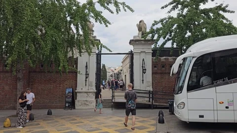 Gate With Stone Pillars and Tour Coach by Brick Wall, Obelisco, Argentina 8K Stock-Footage 306459271