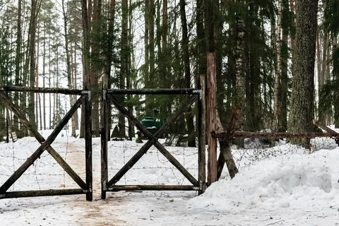 Gates with barbed wire. Stock Photos