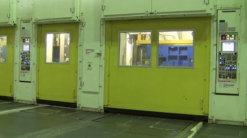 The gates of the stamping lines are opened and replaced by a punch press machine Stock Footage 71833334