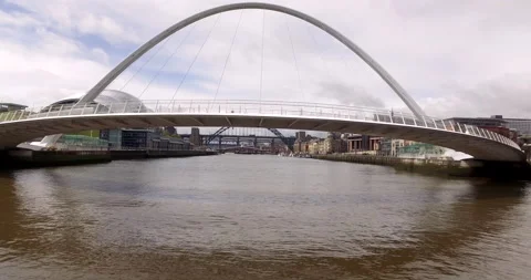 Gateshead Millenium Bridge flying under bridge to view HMS Calliope Stock Footage 159133141