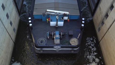Gateway lock sluice construction on river dam for passing ships and boats Stock Footage 98439041