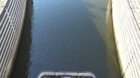 Gateway lock sluice construction on river dam for passing ships and boats Stock Footage 98439081