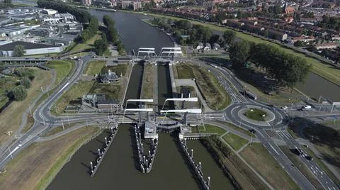 Gateway lock sluice drawbridge construction on river or canal Stock Photos