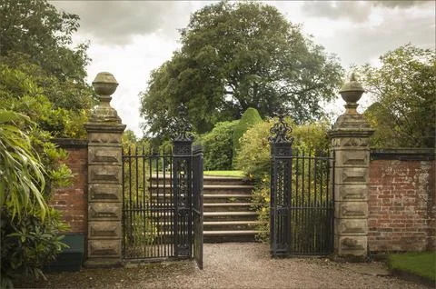Gateway of old sandstone gate posts leading to steps Stock Photos