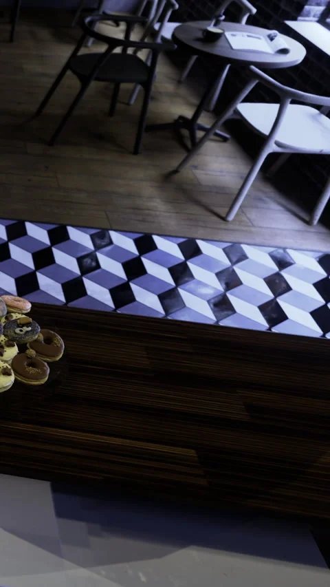 Gathering around a table with snacks and drinks in a cozy cafe setting Stock Footage 331635901